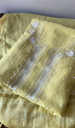 Load image into Gallery viewer, Yellow pure mul chanderi kurta piece folded, fine chikankari in view