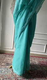 Load image into Gallery viewer, Turquoise saree draped to show the fall of the fabric