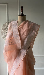 Load image into Gallery viewer, Peach saree draped to show the fall of the fabric