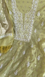 Motifs across the body of the green kurta