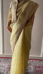 Embroidery on the lemon yellow saree, close view