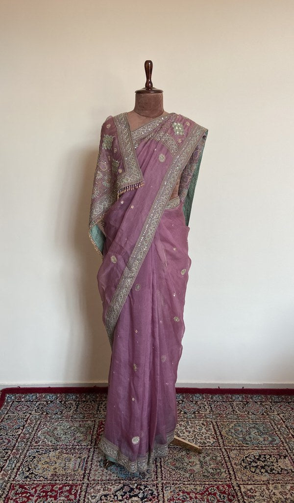 Mauve organza silk saree draped on the mannequin, front view