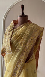 Fine do taar chikankari on border and palla on the lemon yellow saree