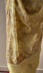 Embroidery on the lemon yellow saree, close view