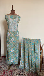 Teal mul cotton set on the mannequin with its dupatta