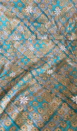 Close view of the teal kurta fabric