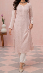 Peach Pink kurti from the front, styled with a white pant