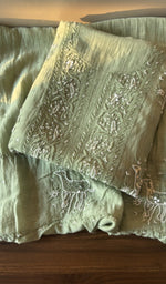 Folded sage green mul chanderi kurta, front view