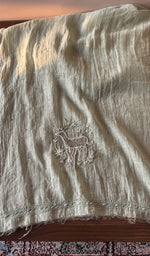 The sage green kurta, spread out flat