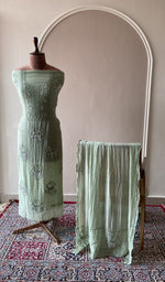 Sage green mul chanderi set on the mannequin with its dupatta