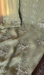 Fine chikankari with allover deer motifs on the sage green mul chanderi