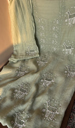 Sage green mul chanderi laid out flat