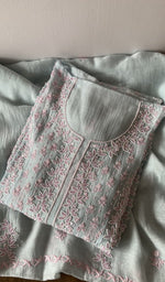 Folded kurta piece and dupatta, chikankari in pink thread along the hem
