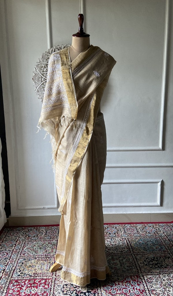 gold pure khadi silk chikankari saree draped on mannequin