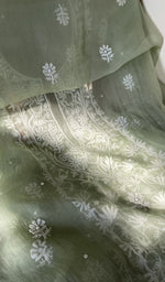 The sage green kurta, spread out flat