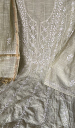 Motifs across the body of the green kurta
