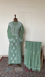Sage green linen set on the mannequin with its dupatta