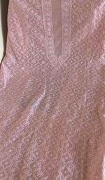 Pink chanderi silk laid flat on the table