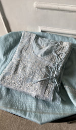 border and hem of the blue kurta piece