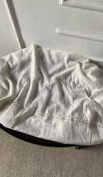 Bottom fabric draped over the stool