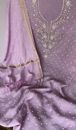 Badla work and beadwork across the body of the kurta piece