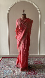 Coral tussar silk saree draped on the mannequin, front view
