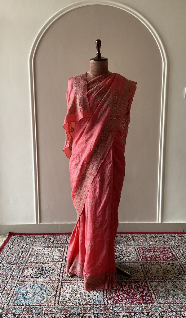 Coral tussar silk saree draped on the mannequin, front view