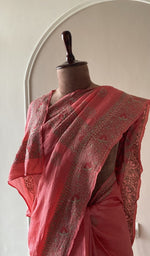 Fine do taar chikankari on border and palla on the coral saree