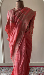 Embroidery on the coral saree, close view