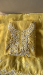 Folded yellow cotton kurta, front view