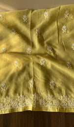 The yellow kurta, spread out flat