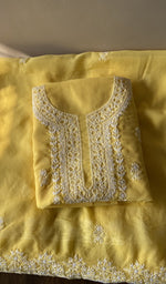Folded yellow cotton kurta, second view