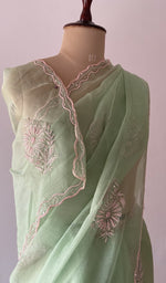 pallu of the green saree, showing the do taar and teen taar chikankari