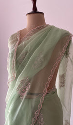 border and edging on the green pure organza silk saree