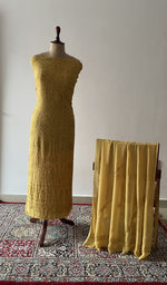 Yellow viscose georgette chikankari suit set on the mannequin with its dupatta