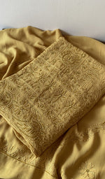 Folded kurta piece and dupatta, chikankari along the hem