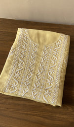 Folded lemon yellow cotton kurta, front view
