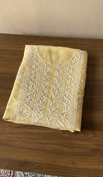 Folded lemon yellow cotton kurta fabric, second view