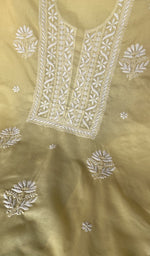 Lemon yellow cotton laid out flat
