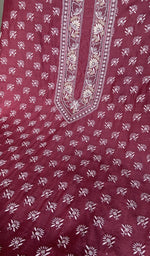 Magenta munga silk laid out flat