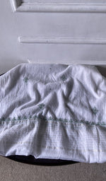 Bottom fabric draped over the stool