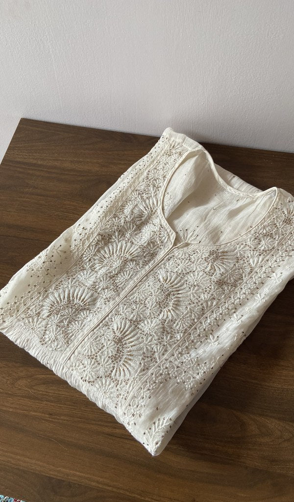 White pure mul chanderi kurti piece folded, fine chikankari