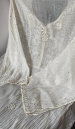 The kurti piece folded on the carpet