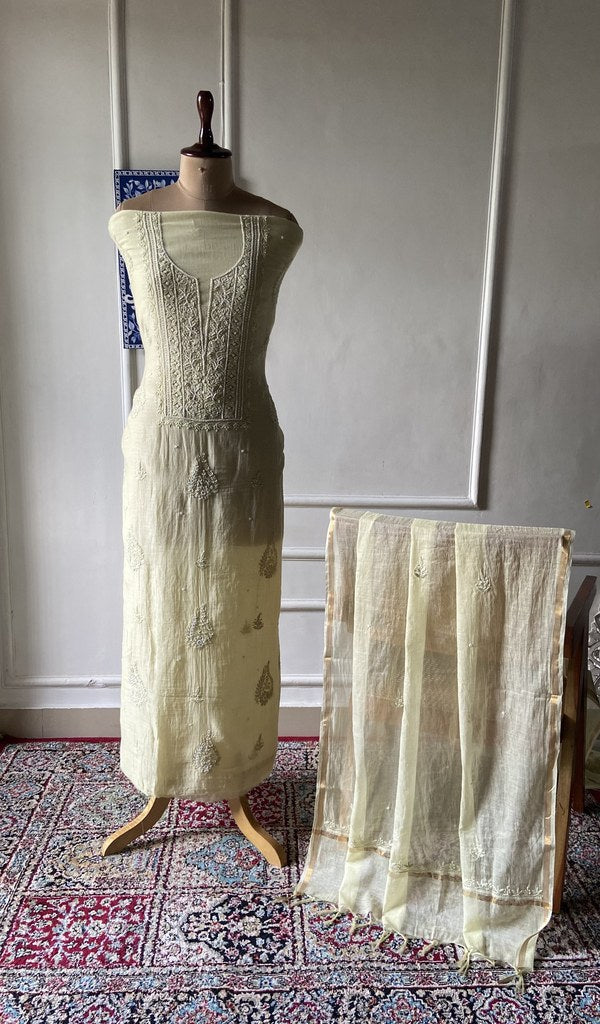 pale yellow pure mul chanderi chikankari 3 pc unstitched suit set on mannequin