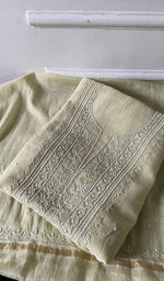 Load image into Gallery viewer, pale yellow chikankari set folded, worked panel on top