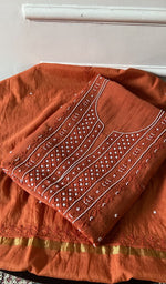 将图像加载到图库查看器中， deep orange chikankari set folded, worked panel on top