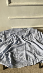 Bottom fabric draped over the stool