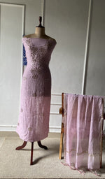 The set on the mannequin with its dupatta beside it