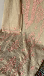 Motifs across the body of the beige kurta