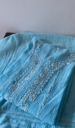 Load image into Gallery viewer, Sky Blue pure mul chanderi kurta piece folded, fine chikankari in view